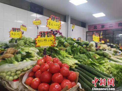 图为北京西城区一家菜市场。 谢艺观 摄 图为北京西城区一家菜市场。 谢艺观 摄